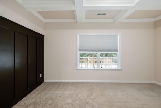 unfurnished bedroom with beamed ceiling, light carpet, and coffered ceiling