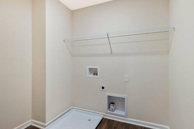 washroom featuring hookup for an electric dryer, dark hardwood / wood-style floors, and washer hookup