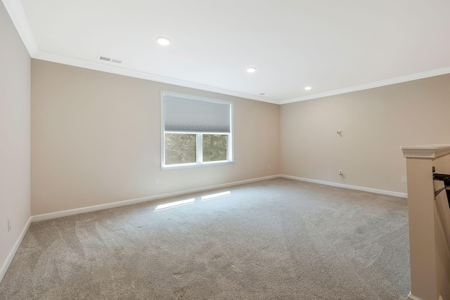 empty room with light carpet and crown molding