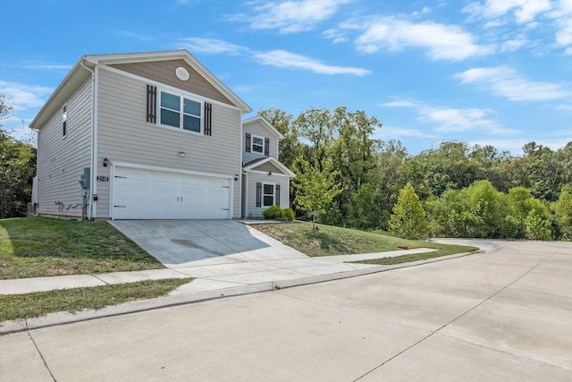 view of front of house with a front lawn and a garage