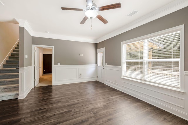 empty room featuring dark hardwood / wood-style floors, ceiling fan, and crown molding