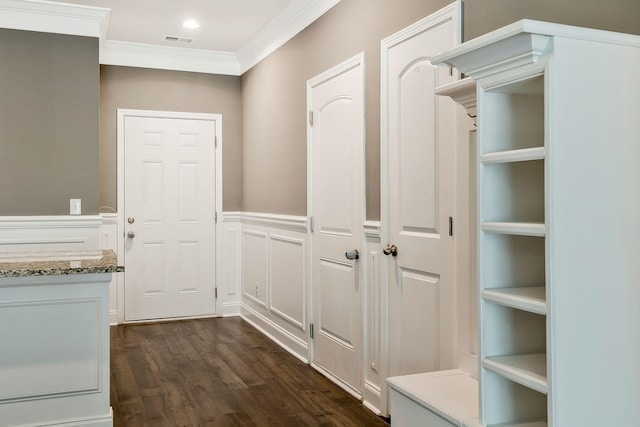 mudroom with dark hardwood / wood-style floors and ornamental molding