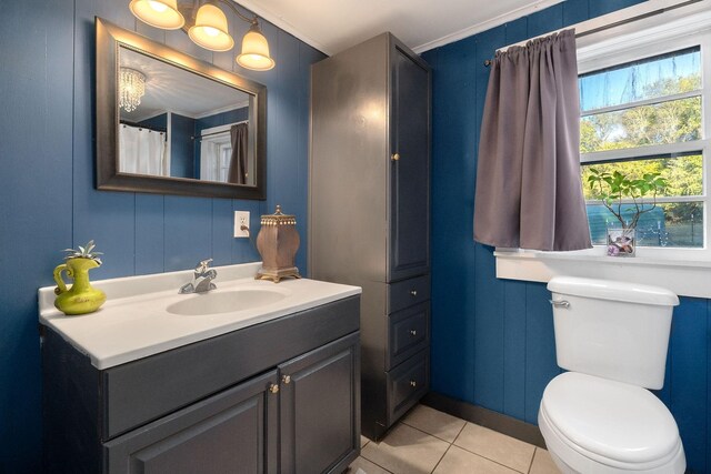 bathroom featuring crown molding, tile patterned flooring, vanity, and toilet