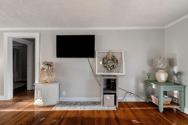 room details with hardwood / wood-style floors, crown molding, and a textured ceiling