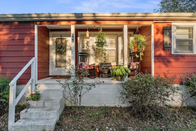 doorway to property with covered porch