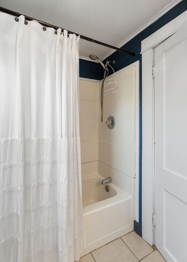 bathroom with tile patterned floors, ornamental molding, and shower / tub combo with curtain