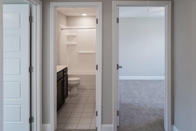 bathroom with tile patterned floors, vanity, and toilet