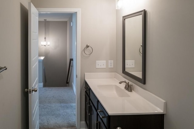 bathroom featuring vanity and an inviting chandelier