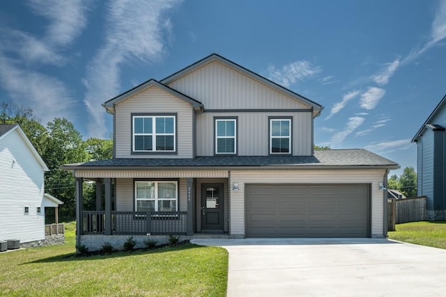 view of front of home with a porch, a garage, and a front lawn