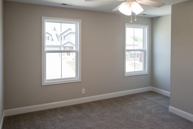 unfurnished room with carpet flooring and ceiling fan