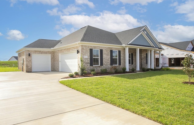 view of front facade featuring a front lawn and a garage