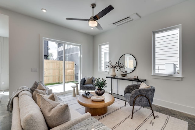 sitting room featuring ceiling fan