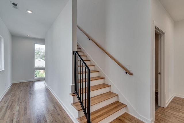 staircase featuring hardwood / wood-style floors