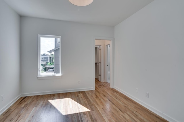 empty room with light hardwood / wood-style floors