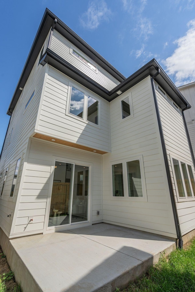 rear view of house featuring a patio area