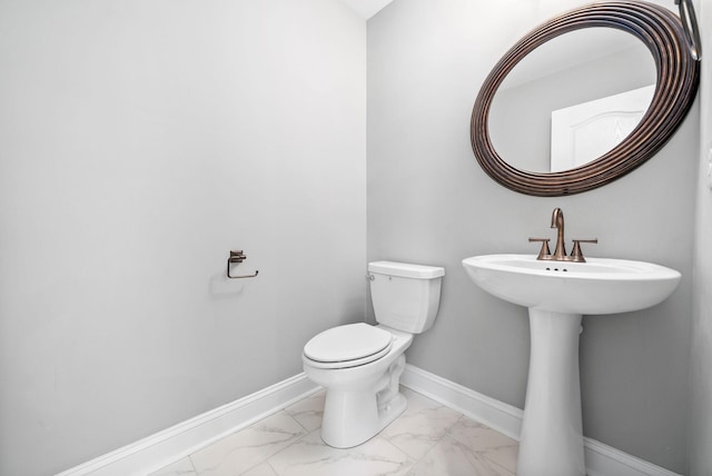 bathroom with toilet and sink