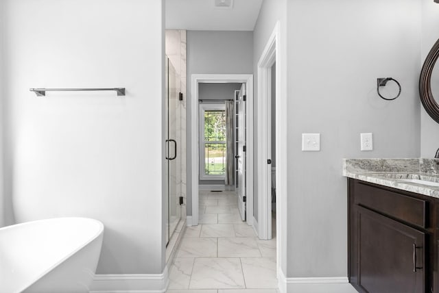 bathroom featuring plus walk in shower and vanity