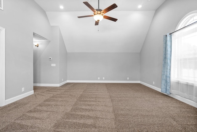 bonus room with ceiling fan, carpet, a healthy amount of sunlight, and lofted ceiling