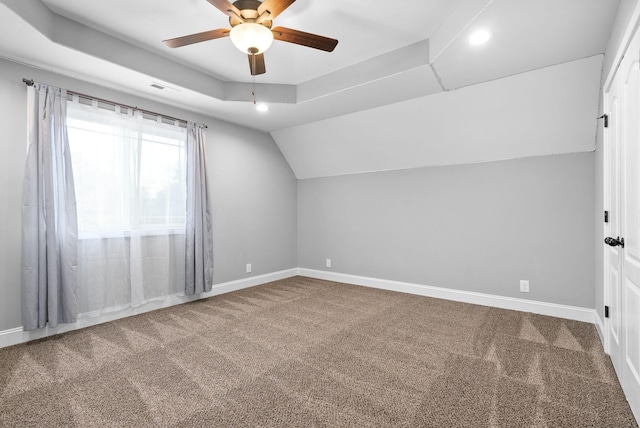 additional living space with ceiling fan, carpet, and lofted ceiling