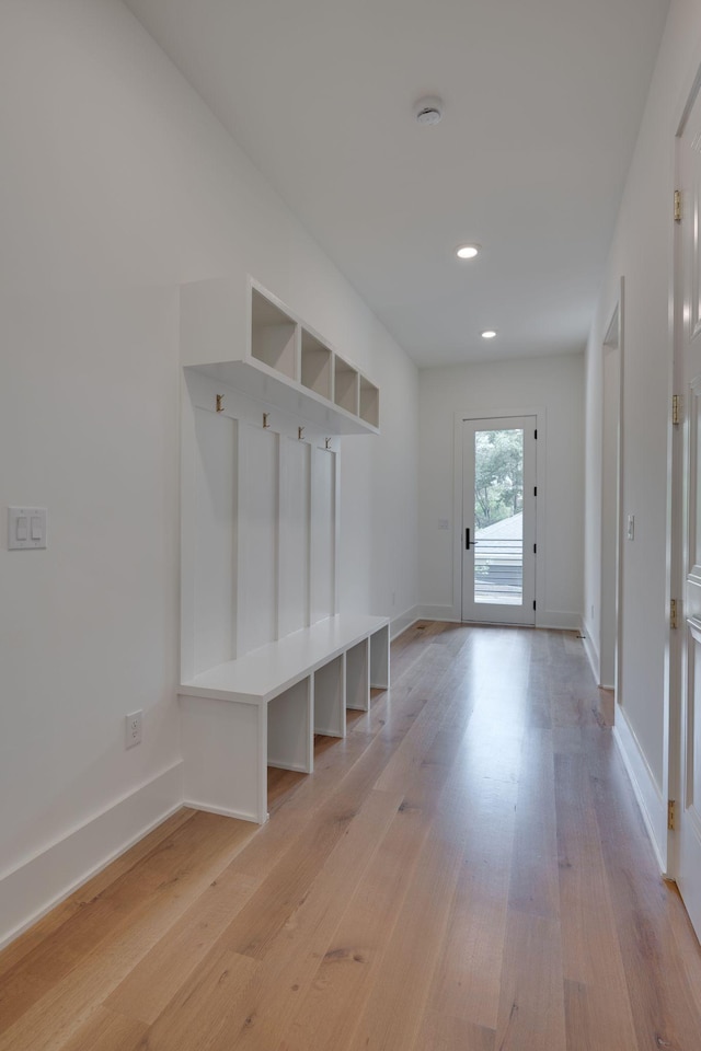 mudroom with light hardwood / wood-style floors