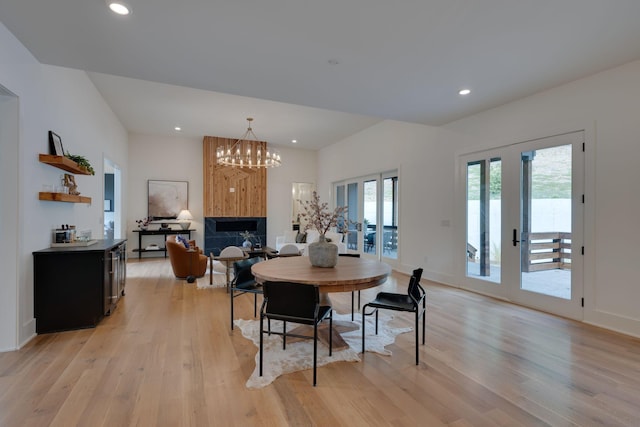 dining room featuring light hardwood / wood-style floors and an inviting chandelier