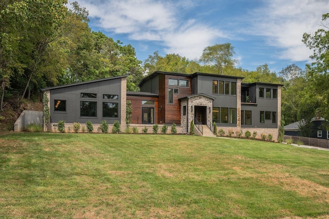 modern home featuring a front lawn