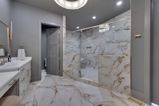 bathroom with vanity and an enclosed shower