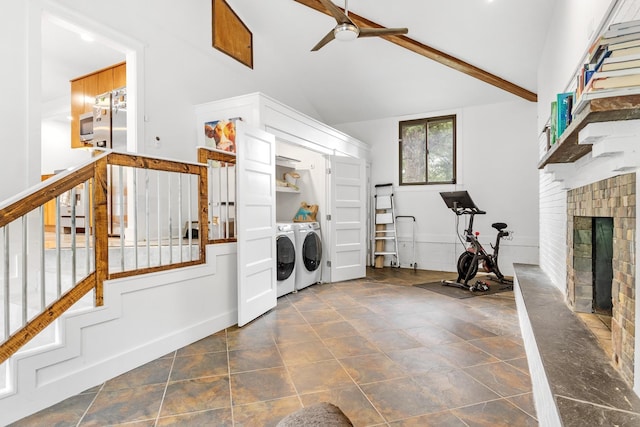 laundry room with washer and dryer, ceiling fan, and a fireplace