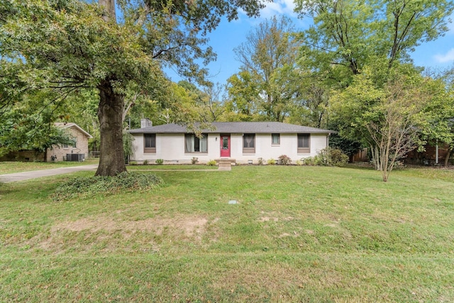 ranch-style house featuring central AC and a front lawn