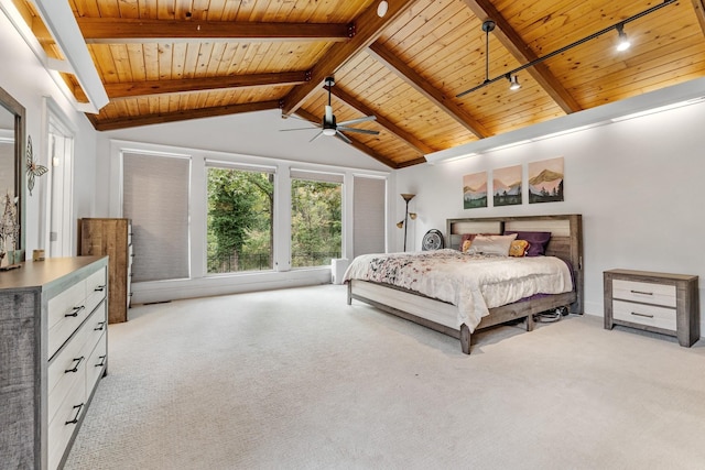 carpeted bedroom with vaulted ceiling with beams, ceiling fan, and wooden ceiling