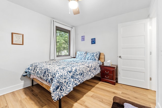 bedroom featuring hardwood / wood-style floors and ceiling fan