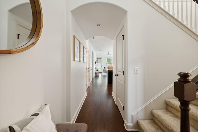 hallway with dark hardwood / wood-style floors