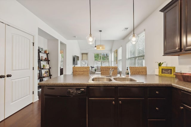 kitchen with sink, black dishwasher, vaulted ceiling, decorative light fixtures, and dark brown cabinets