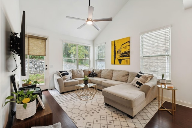 living room with ceiling fan, high vaulted ceiling, and light hardwood / wood-style floors