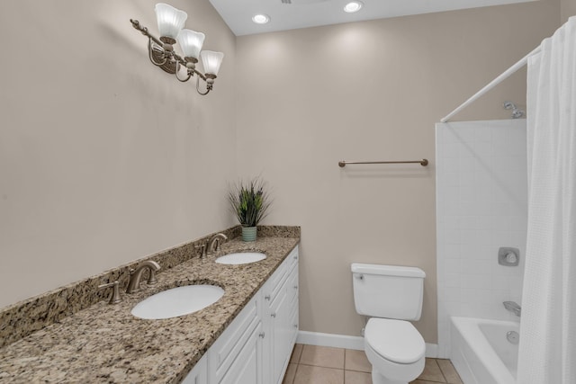 full bathroom featuring tile patterned floors, vanity, toilet, and tiled shower / bath combo