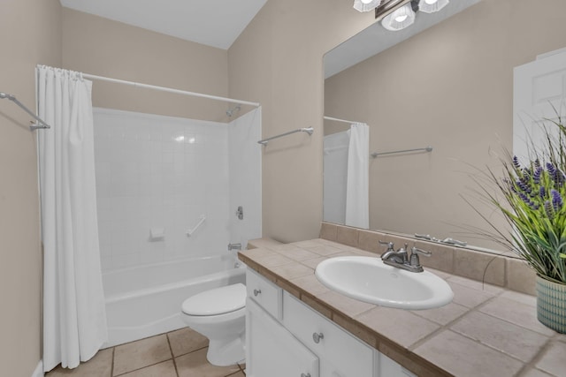 full bathroom featuring tile patterned floors, shower / bath combination with curtain, toilet, and vanity