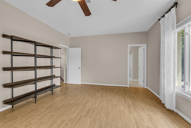 interior space with ceiling fan and light hardwood / wood-style floors