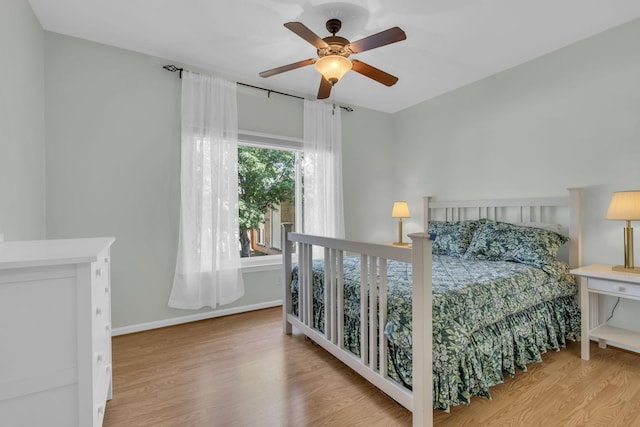 bedroom featuring light hardwood / wood-style floors and ceiling fan