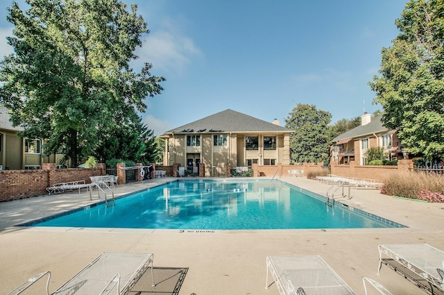 view of pool featuring a patio area