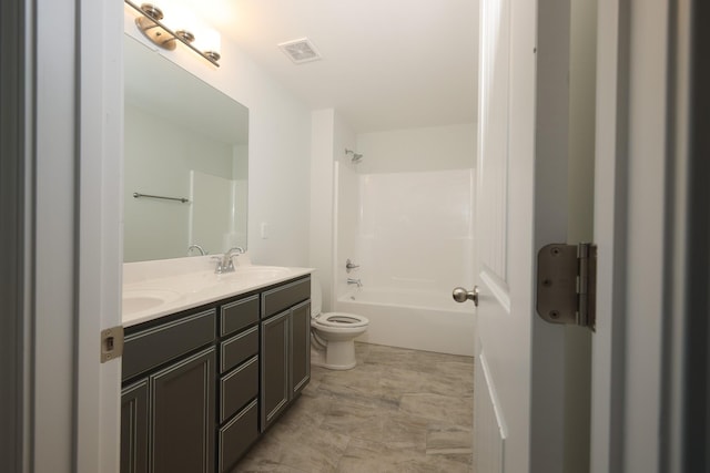 full bathroom with vanity, bathing tub / shower combination, and toilet