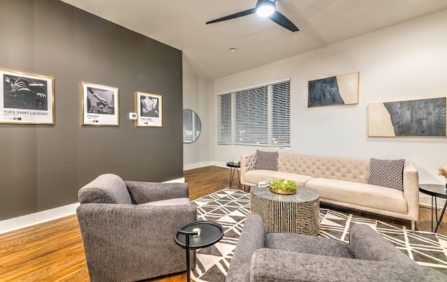 living room with hardwood / wood-style flooring and ceiling fan