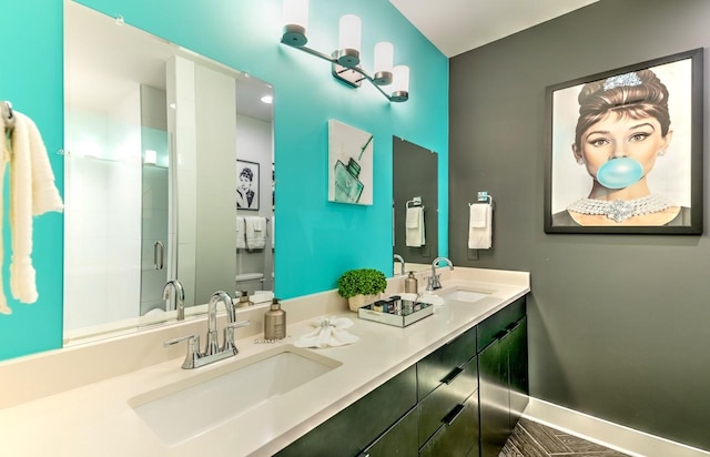 bathroom featuring vanity and an enclosed shower