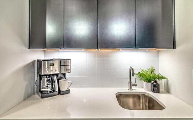 kitchen featuring backsplash and sink