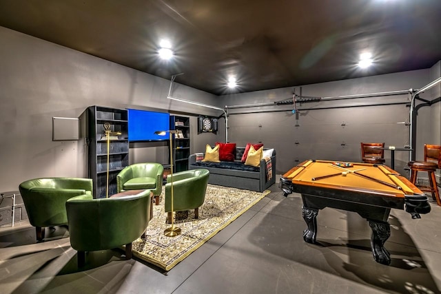 recreation room featuring concrete flooring and billiards