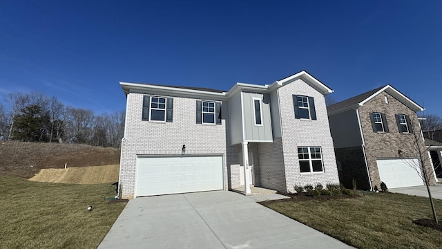 view of front of home with a garage and a front yard