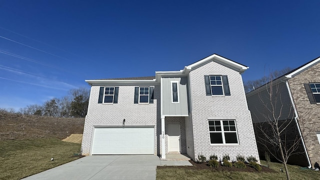 front of property featuring a garage and a front yard