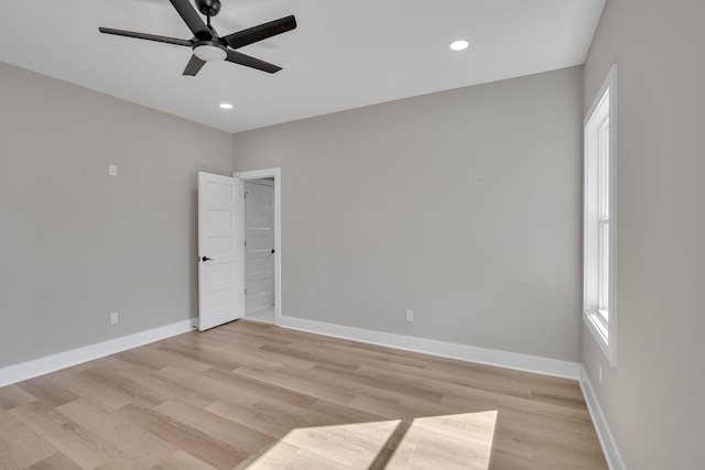 empty room with light wood-type flooring and ceiling fan