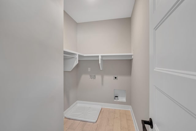 clothes washing area featuring washer hookup, hardwood / wood-style floors, and electric dryer hookup