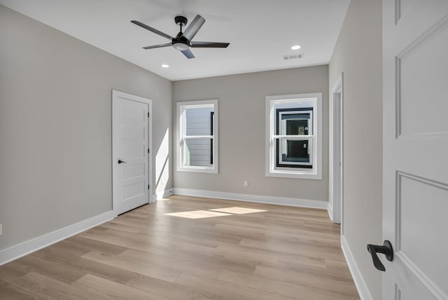 unfurnished room featuring ceiling fan and light hardwood / wood-style floors