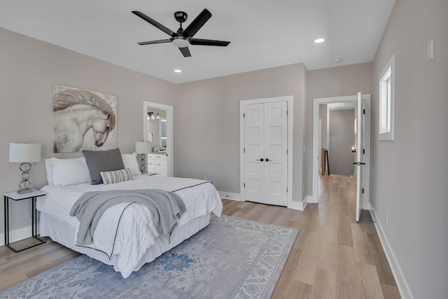 bedroom featuring ceiling fan and light hardwood / wood-style flooring